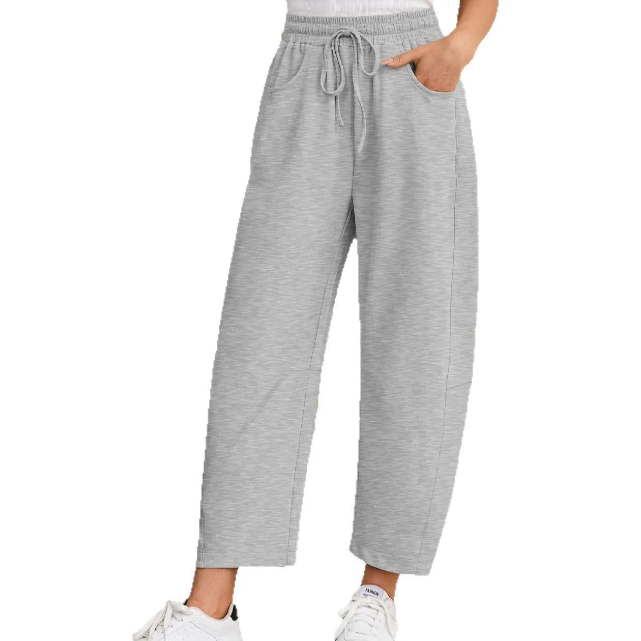 Loose cropped sweatpants with drawstring waist and side pockets in apricot colour