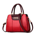 Large beige ladies handbag with stitched PU exterior, zipper closure, and soft handle on a flat surface