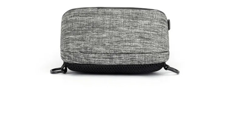 Dark blue Oxford cloth chest bag with a zip and adjustable strap, shown with a phone in its dedicated internal pocket.