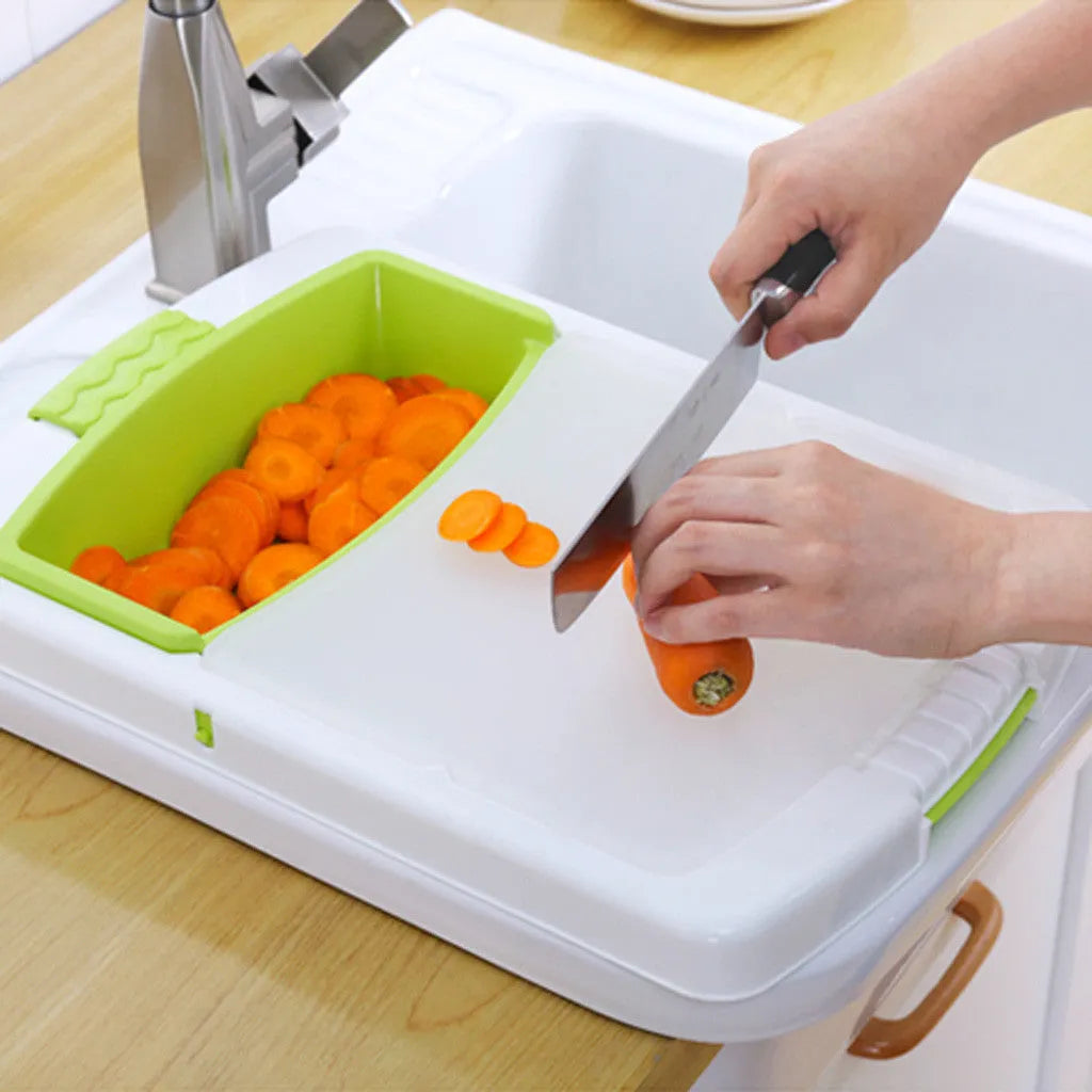 Green multi-function cutting board with drain holes mounted on a kitchen sink edge