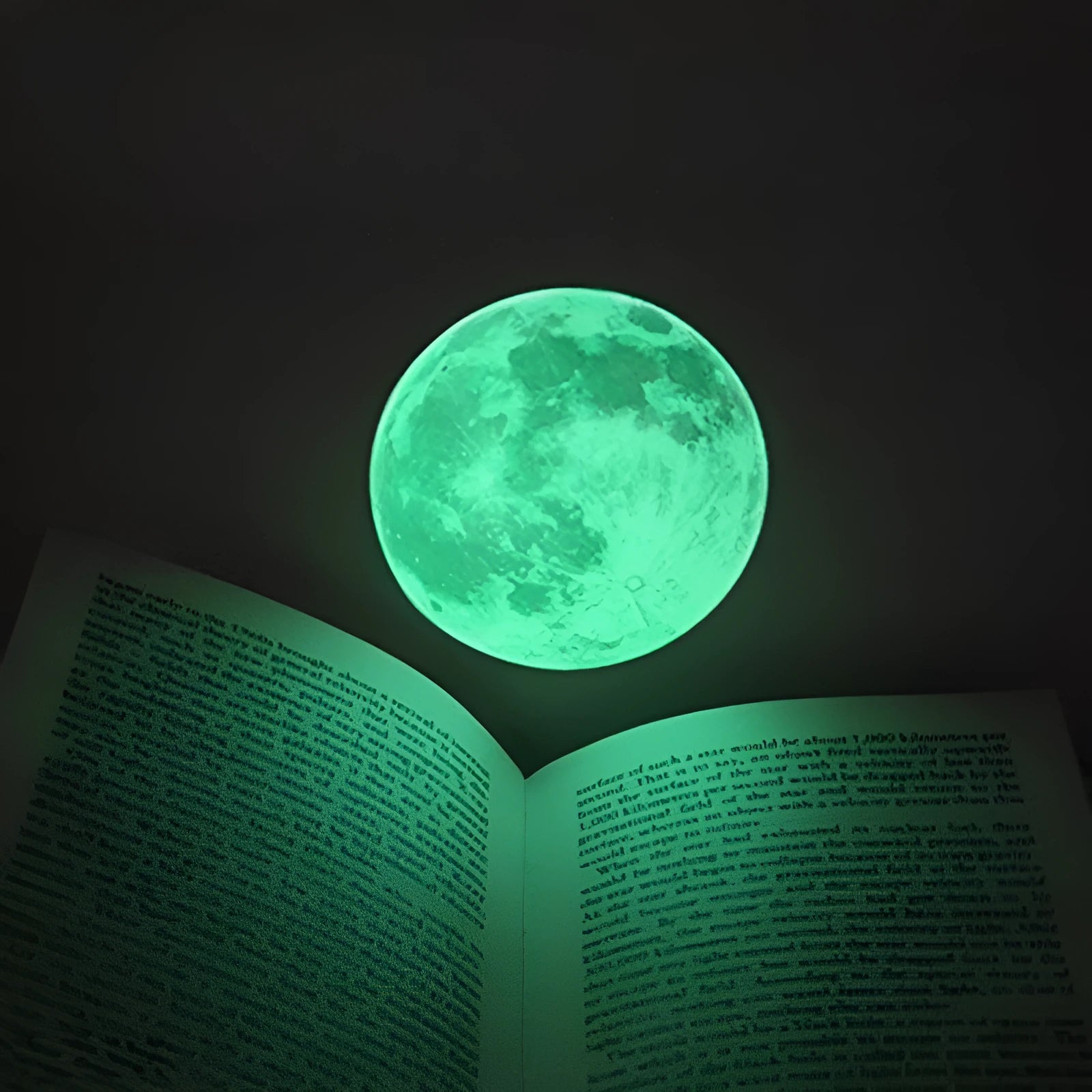30cm green fluorescent glow moon wall sticker on a wall, glowing in the dark