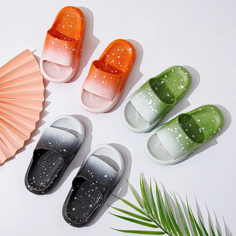 Blue gradient PVC slippers for children on a white background showing the non-slip sole pattern.
