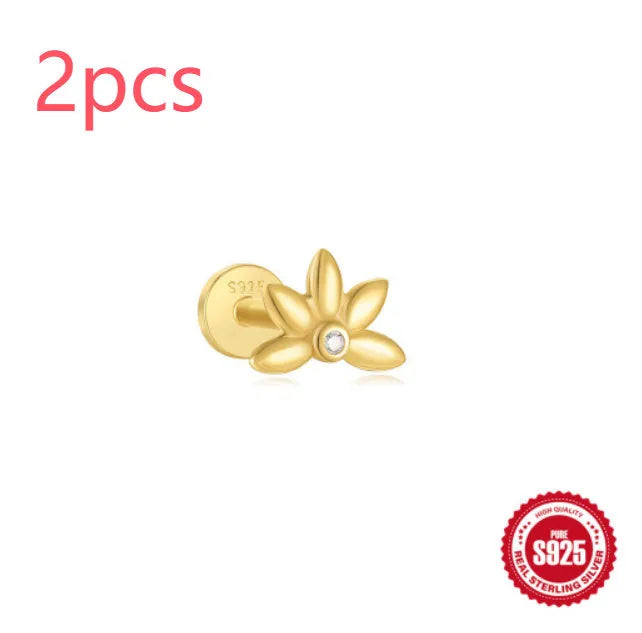 Sterling silver ear stud with a hanging gold-tone tassel charm on a white background.
