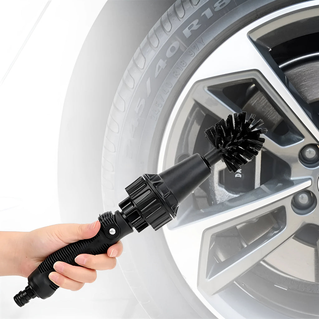 Water-driven rotary cleaning brush in black and yellow for car tyre and wheel cleaning with garden hose