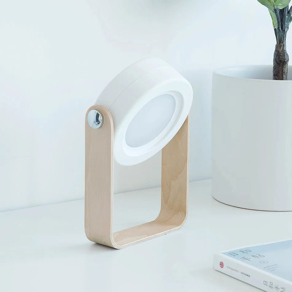 Foldable touch dimmable LED night light in white showing table lamp and lantern positions