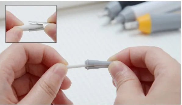 Black electric eraser with plastic body and geometric design on a white background