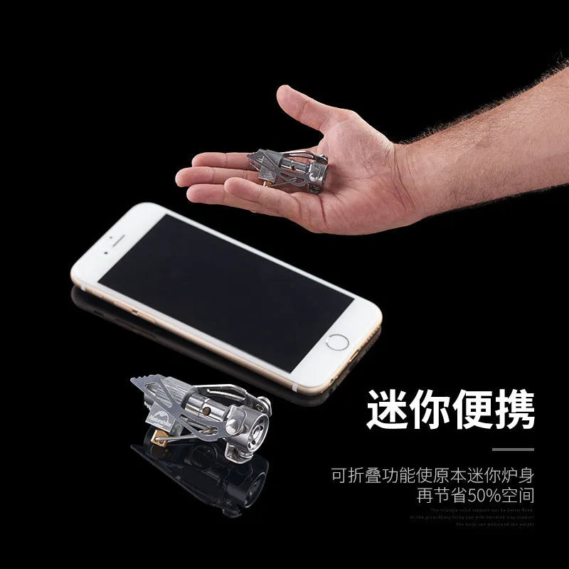 Portable folding mini camping stove in unfolded position showing 3000W burner and anti-skid bracket