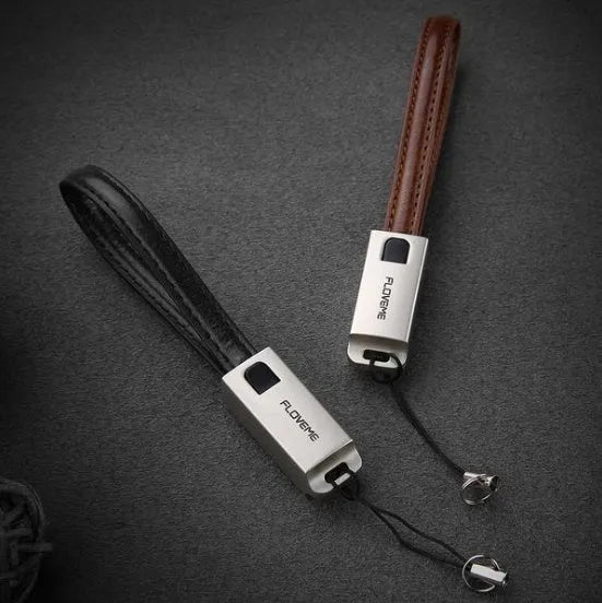 Short 20cm black leather USB to Apple Lightning charging cable with zinc alloy connector.