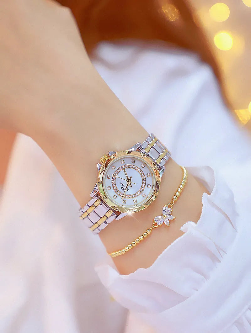Women's quartz watch with 32mm round dial, alloy case, and mineral glass in a choice of gold or silver finishes