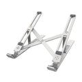 Silver aluminum folding laptop stand shown at an angle on a desk