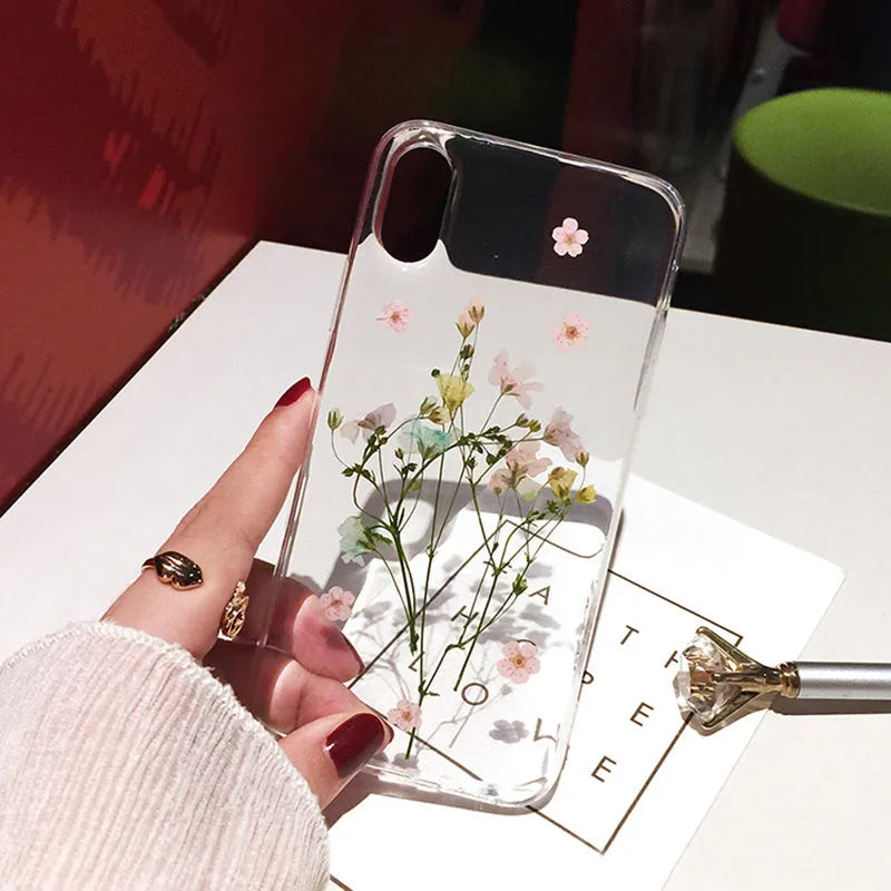 Handmade clear iPhone case with real dried flowers in epoxy resin on soft TPU back cover