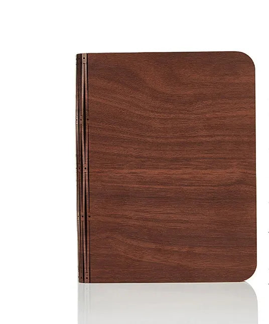 Solid wood USB-powered book light in three size options on a wooden table.