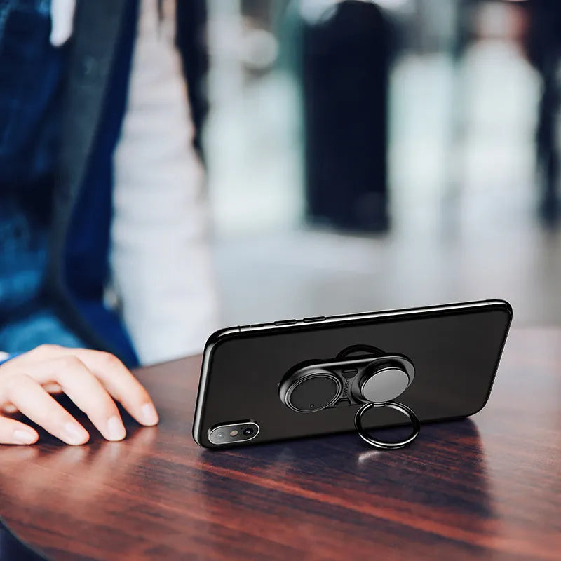 Multifunctional rotating mobile phone holder on a desk showing 360-degree swivel, adjustable angle, in Black colour