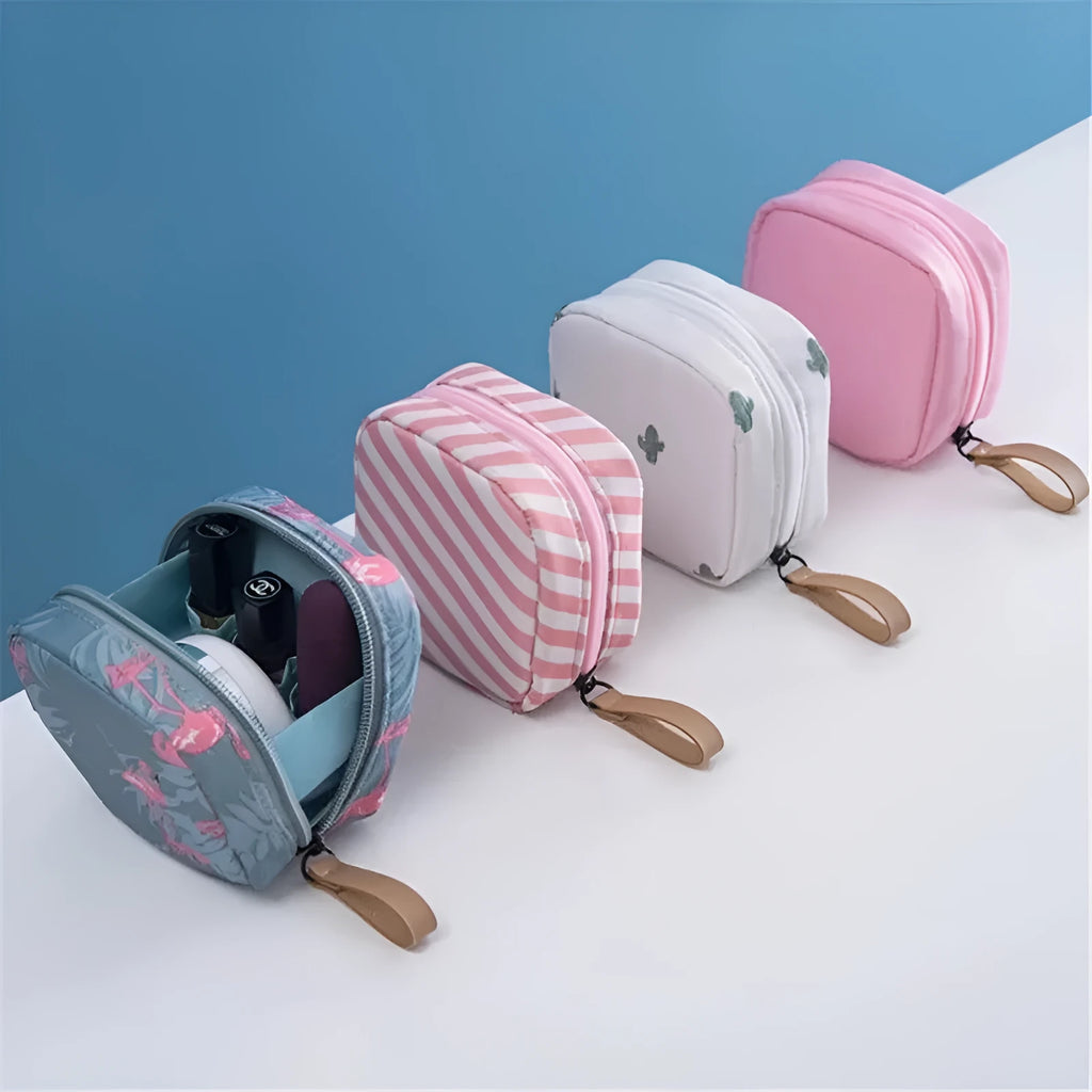 Blue cloth cube-shaped makeup storage bag with plain pattern, open to show interior space.