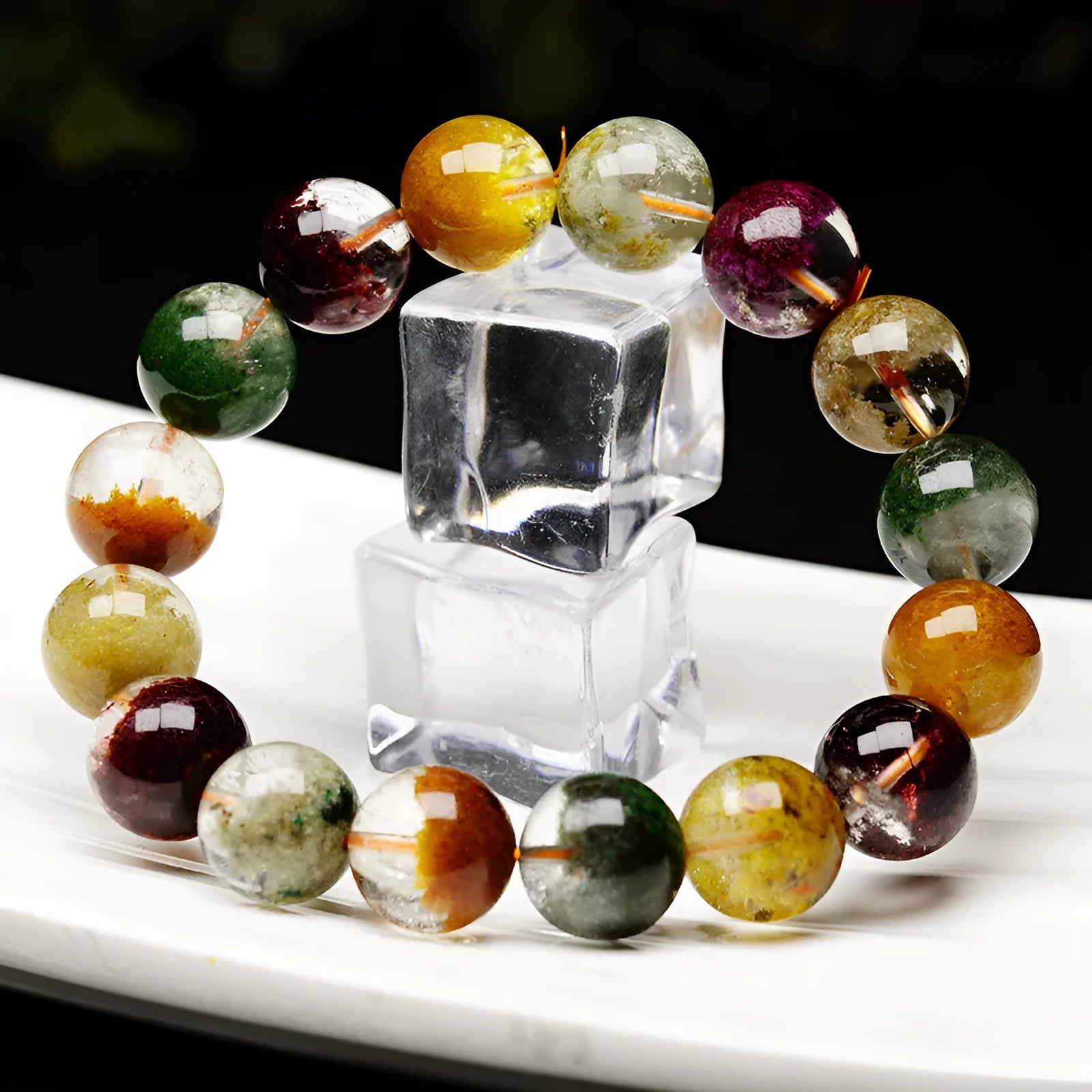 Crystal bracelet with 10mm beads showing a colourful natural four seasons ghost cornucopia ethnic design.