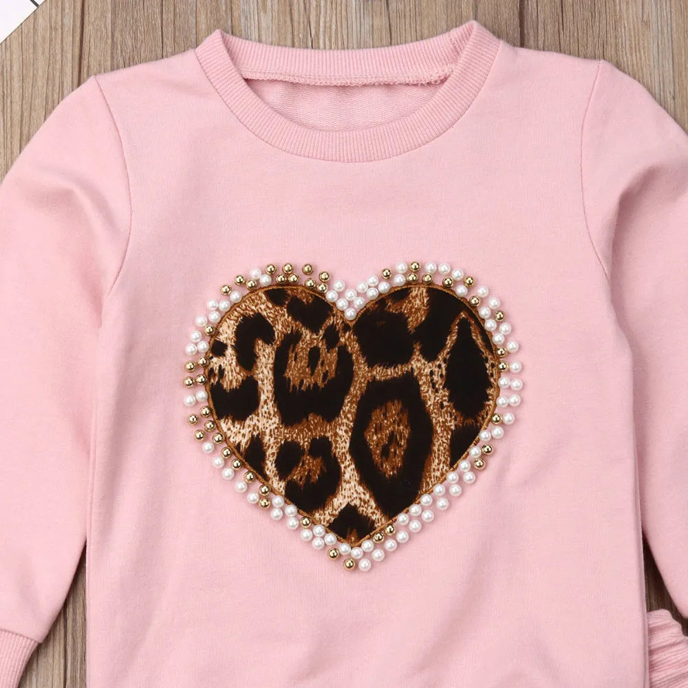 Children's pink cotton print sweatshirt and trousers two-piece set on white background