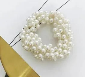 Cloth beaded hair rope in black colour on a white background