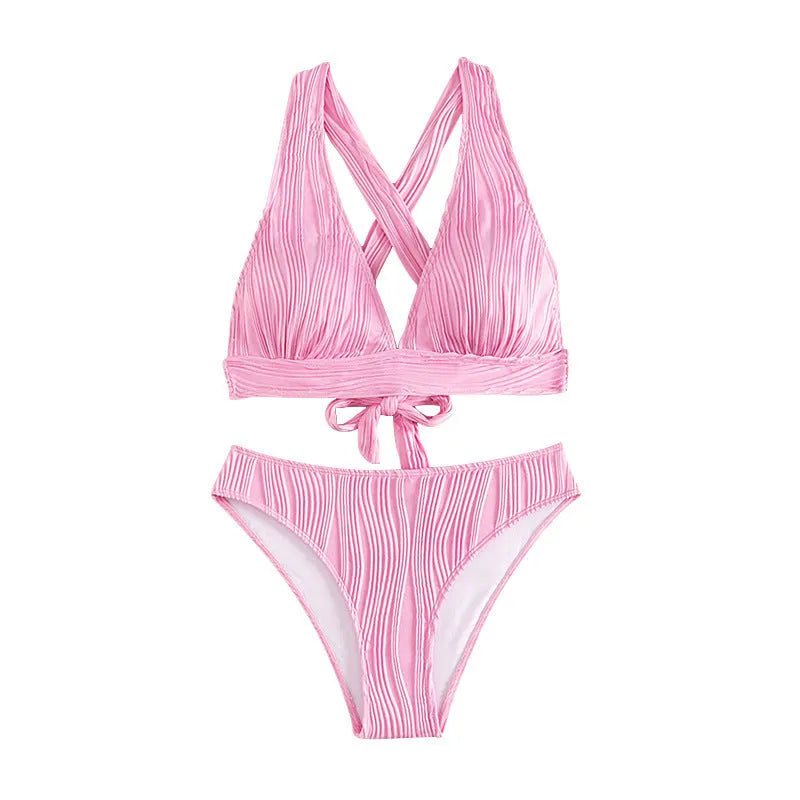 Women's pink halter strap bikini top and shorts swimsuit set on a mannequin.