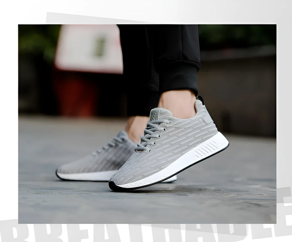 Men's Malcom low-top sneaker with mesh fabric upper and MD sole in black, grey, and white
