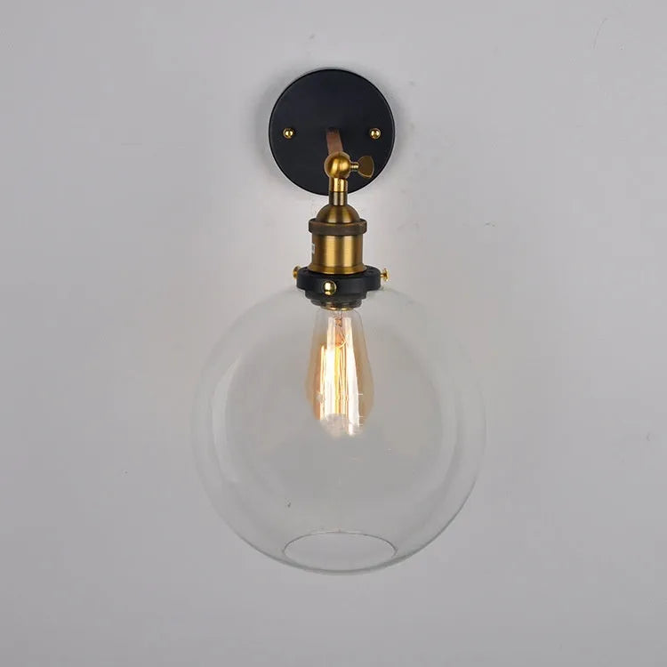 20cm round retro glass wall lamp with an aluminium holder in amber finish