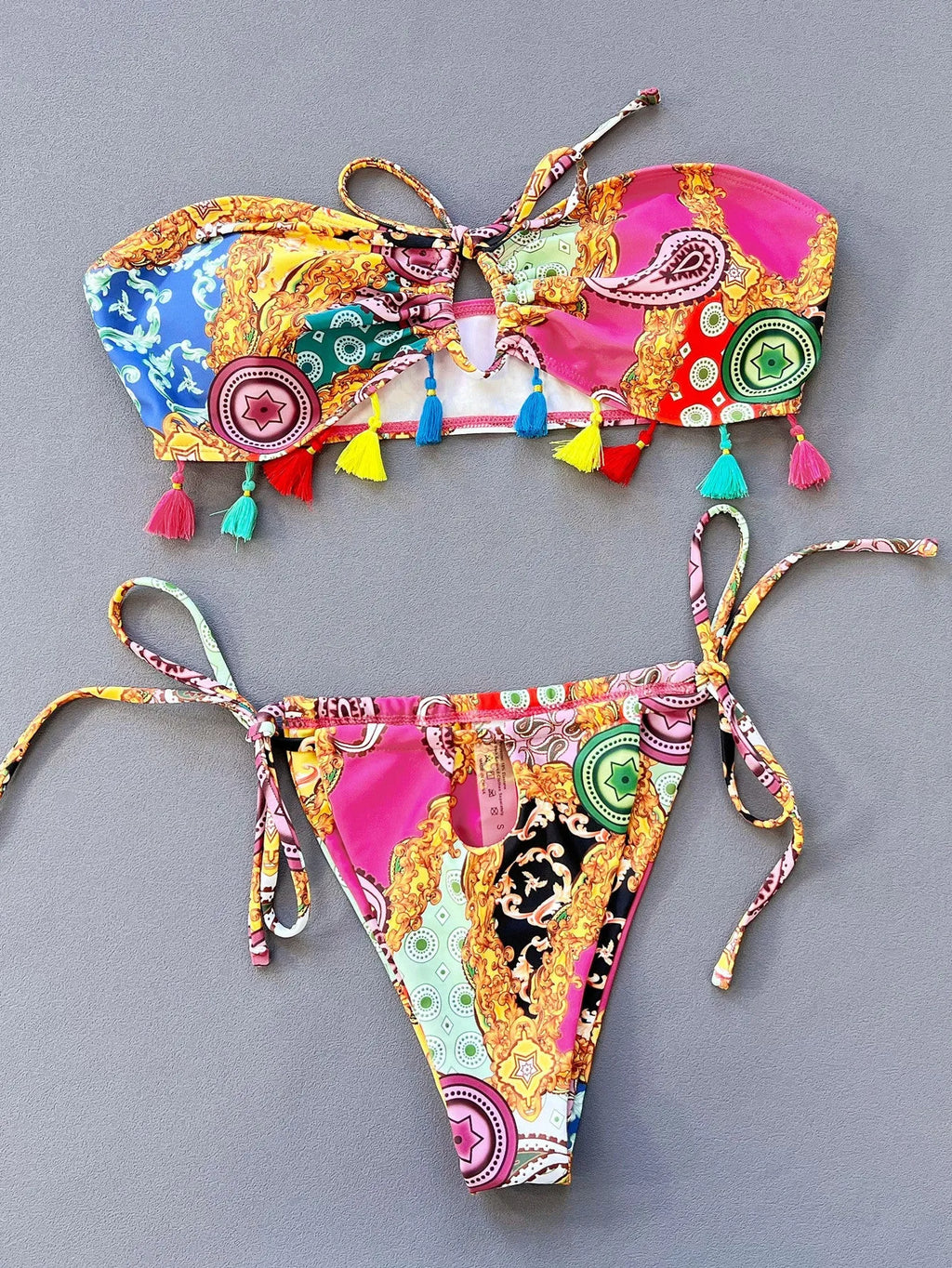 Women's printed polyester separated bikini set with tube top and briefs for swimming.