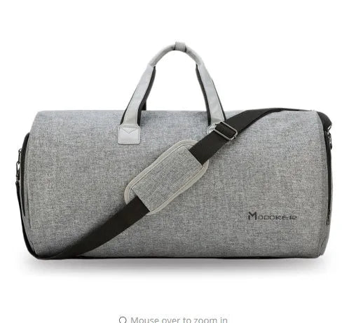 Travel garment bag in black and gray with adjustable shoulder strap, hanging suit carrier, and multiple pockets on a neutral background