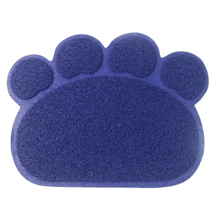 Claw-shaped rectangular PVC cat litter mat in dark blue, 30x40cm, placed in front of a litter tray