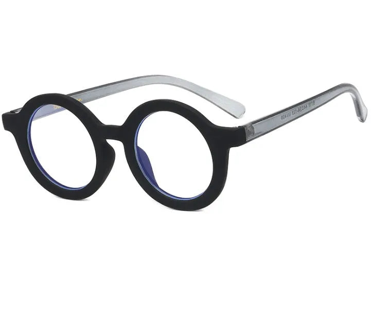 Retro round frame anti blue light glasses in multiple colours on a plain background.
