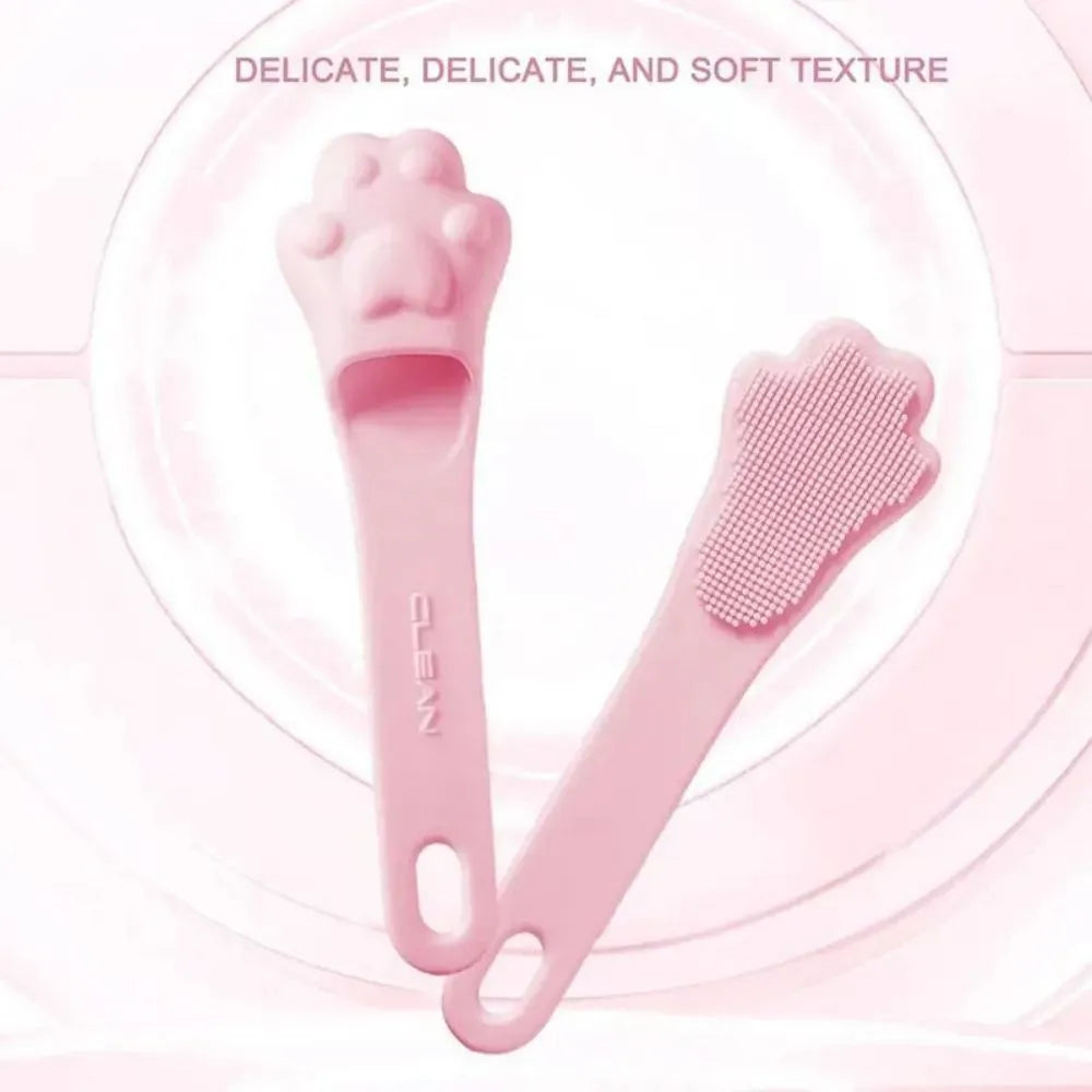 Pink silicone finger cover toothbrush for pets on a white background