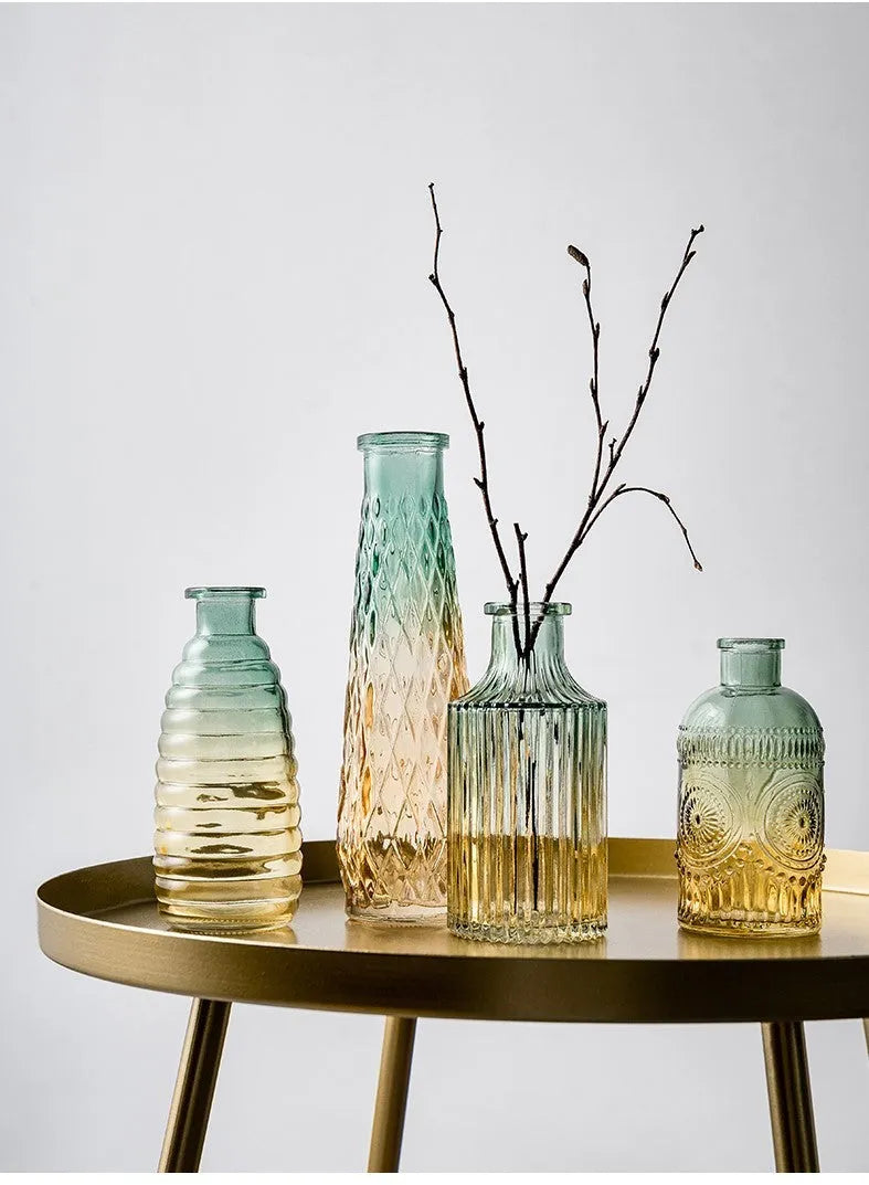 Set of five clear glass vases with colourful electroplated finish and thicker stable bottoms in various sizes