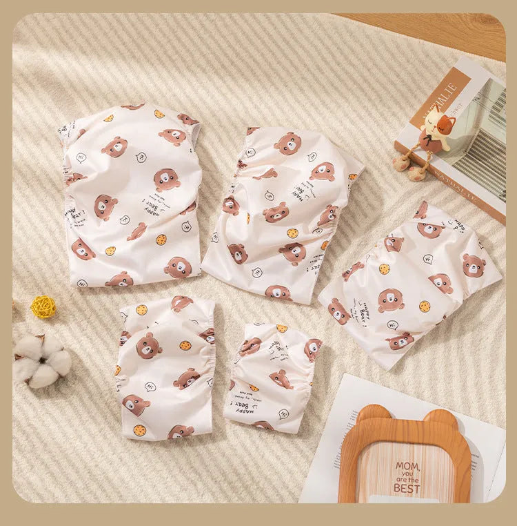 Reusable male dog diaper belly band with cartoon bone paw print design and fastener tape.