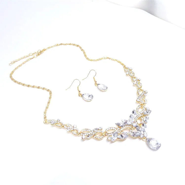Gold alloy clavicle chain necklace with bow pendant on display