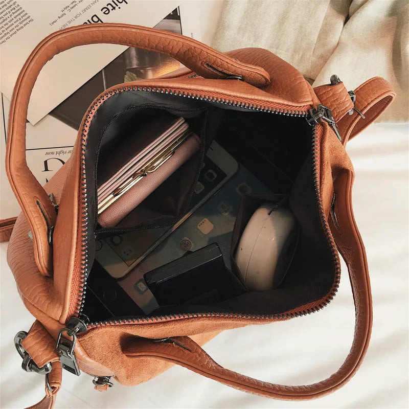 Soft grey PU leather large tote bag for women shown with zip open.