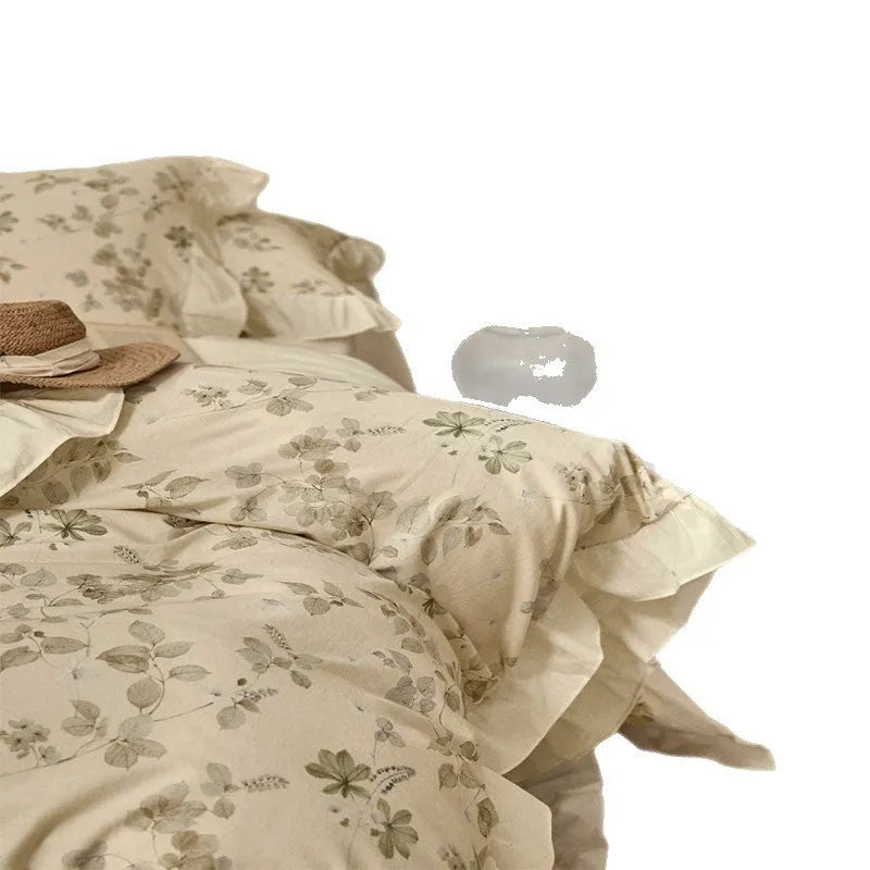Cotton linen yarn-dyed printed four-piece bedding set in Raw Jute Colour with plants and flowers pattern on a bed