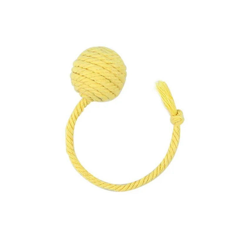 Cat toy ball with rope attached in green, pink, purple or yellow colour with internal bell