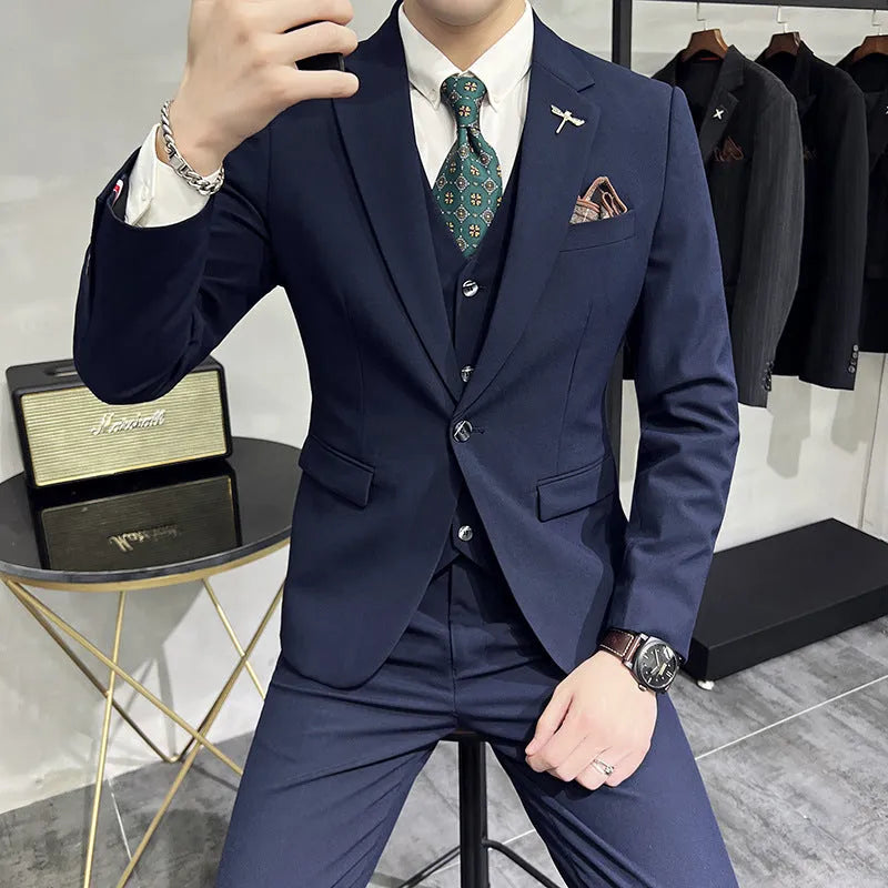 Three-piece men's acetate fibre blend business suit set in light gray with jacket, trousers, and vest.