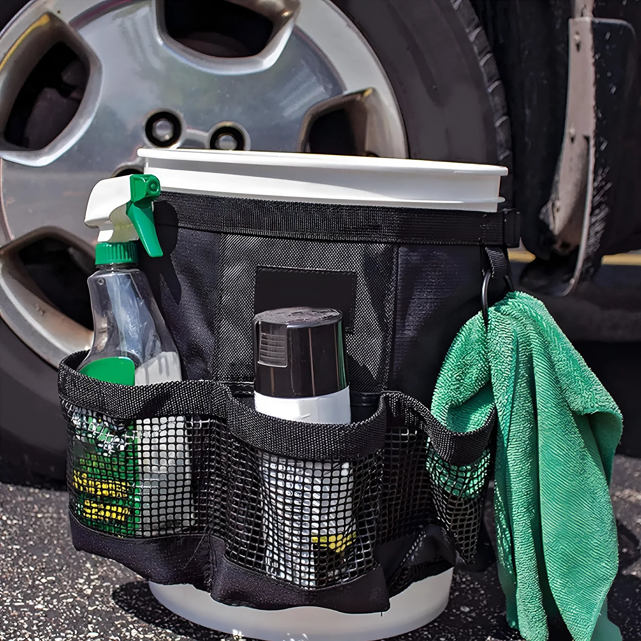 Black cylindrical polyester storage bag hanging on a 5 gallon bucket.