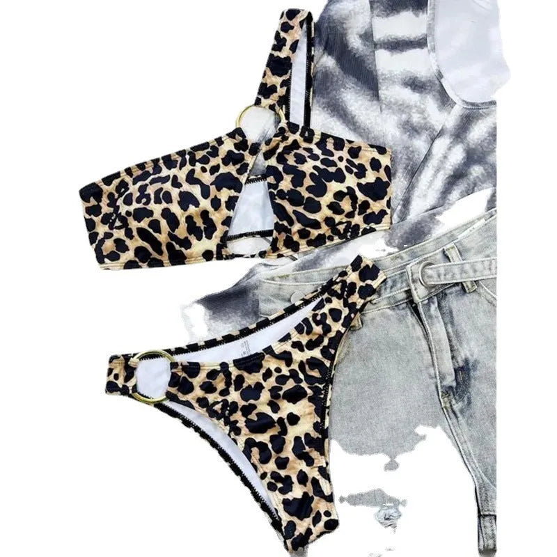 Women's hollow leopard print with polka dots bikini top and shorts set on a mannequin.