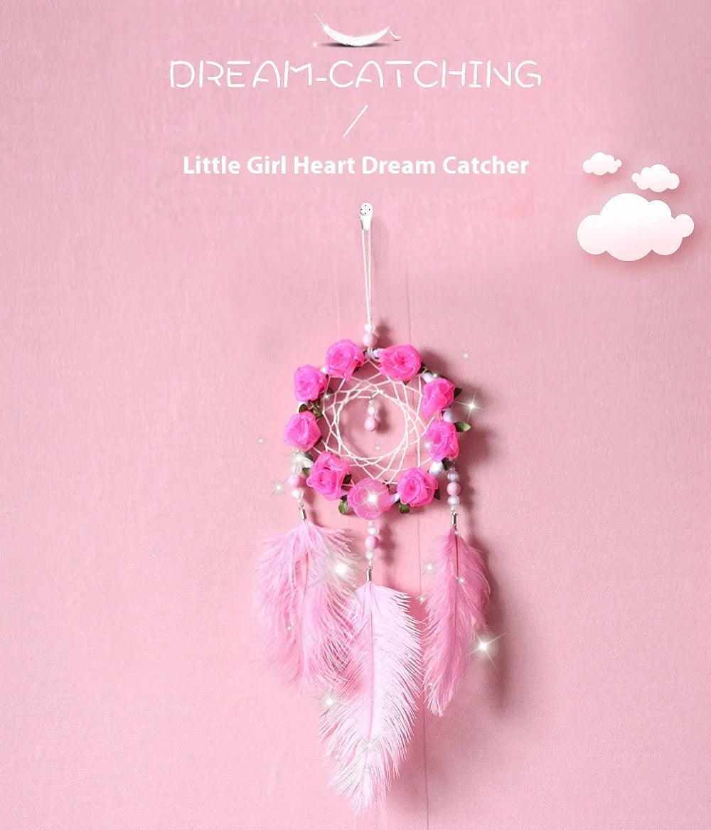 Close-up of a modern pink ostrich feather dreamcatcher wind chime wall ornament.