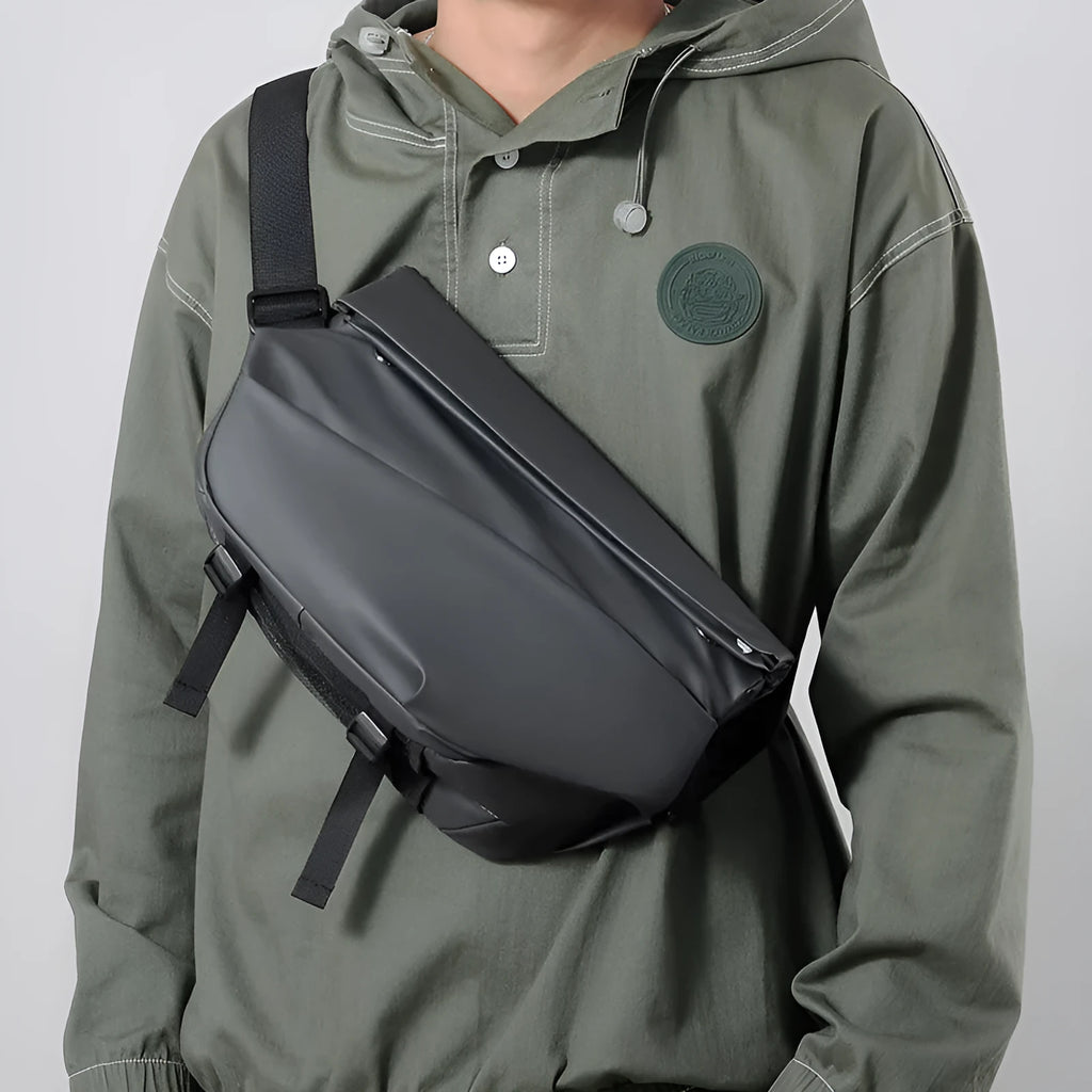 Grey PU leather crossbody bag for men showing front zipper and adjustable shoulder strap