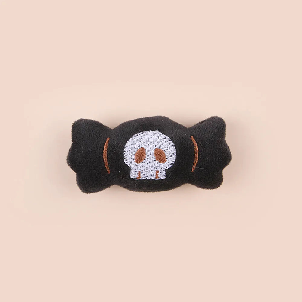 Small plush cat teaser wand toy on a white background, showing eye, candy, and skull design options.