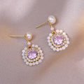 Natural freshwater pearl flower-shaped earrings in purple with diamond treatment finish