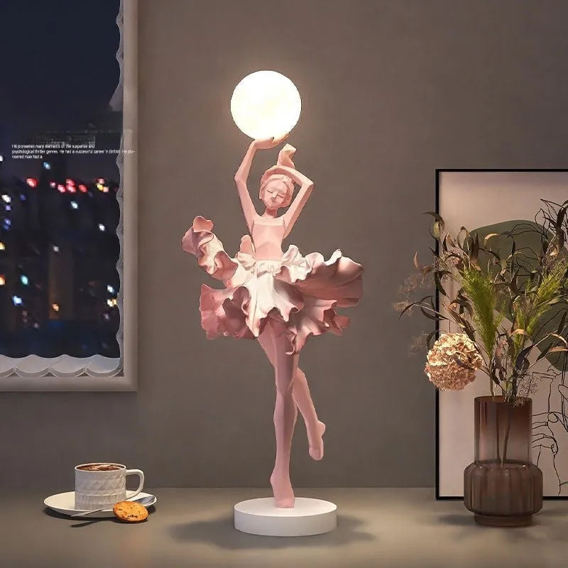Small modern resin night lamp in black gold colour with USB charging cable.