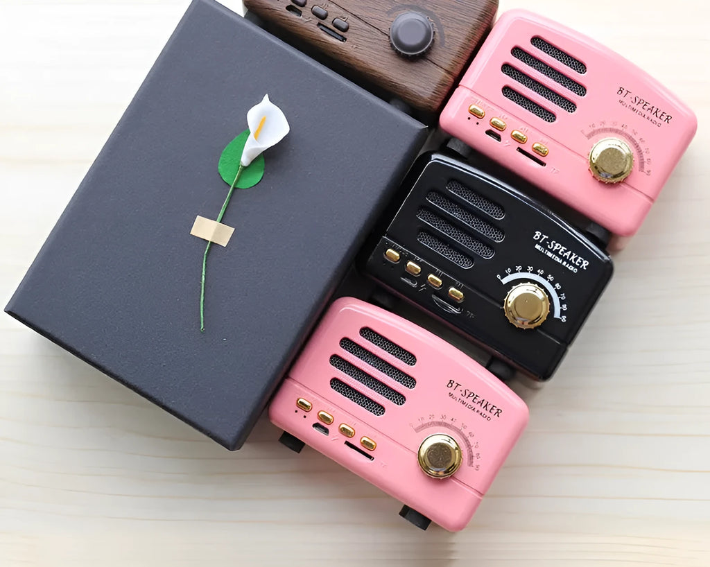 Vintage-style Bluetooth speaker with wood grain finish, showing compact size and front speaker grill.