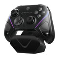 Smart Startstop Rocker game controller on its charging base, shown in Black, Green, and Purple colour options.