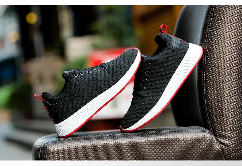 Men's Malcom low-top sneaker with mesh fabric upper and MD sole in black, grey, and white