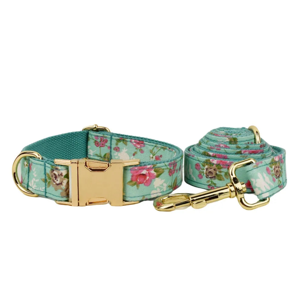 Fabric dog collar set with rose pattern detachable bow, matching leash, and optional vest in green background