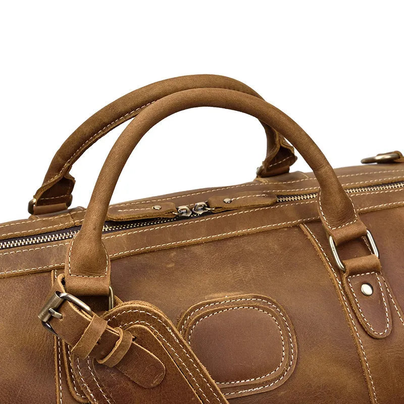 Genuine cowhide leather large capacity luggage bag in light brown with zipper closure and top handles
