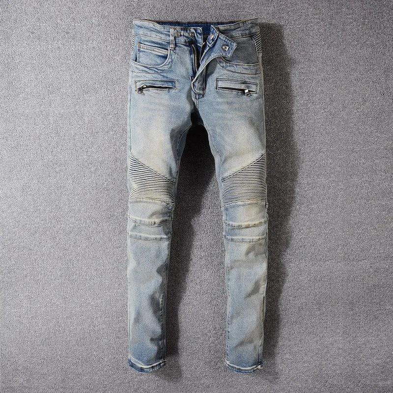 Grey biker jeans with straight tube leg, mid-rise waist, zipper fly, and distressed denim finish
