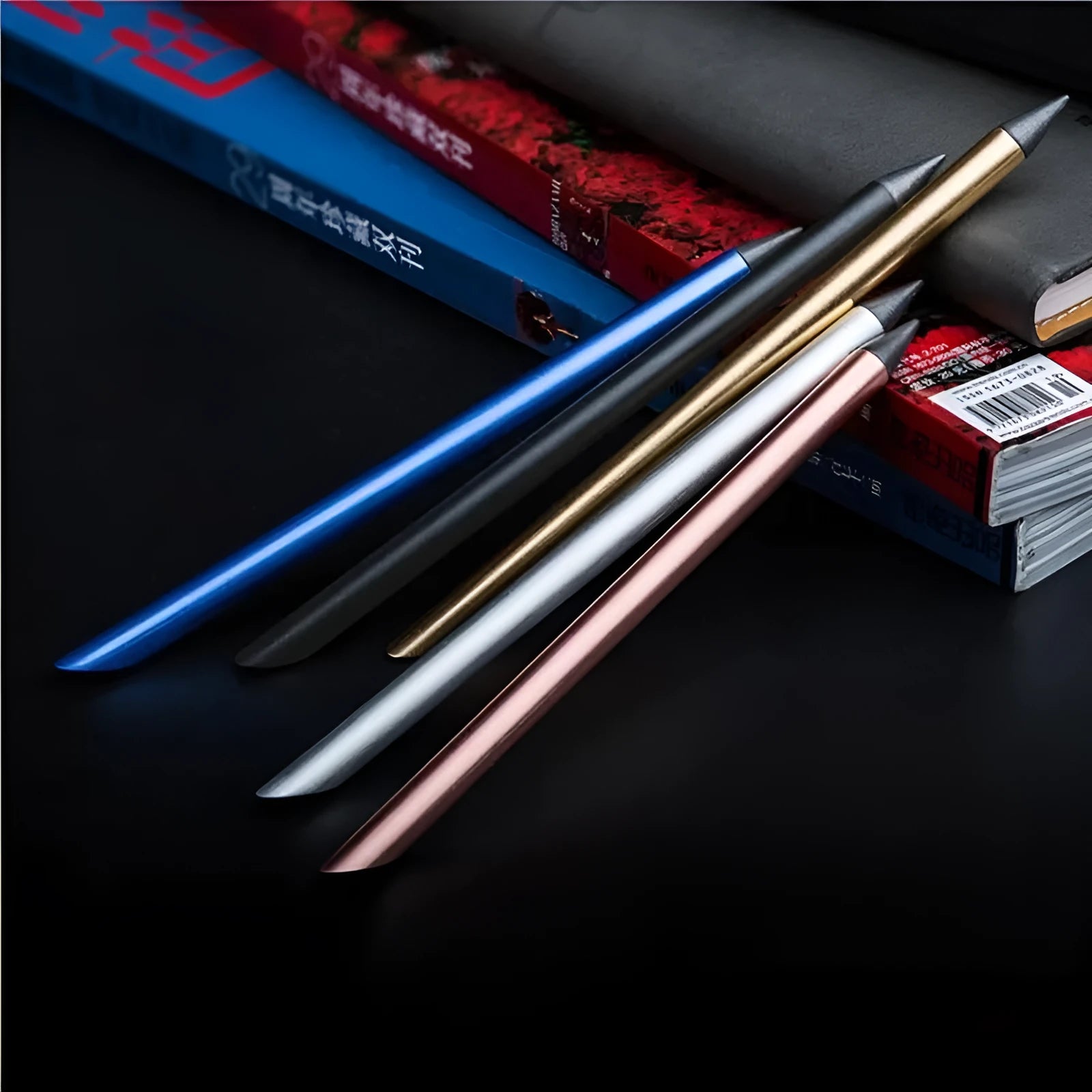 Inkless Metal Pen in silver finish with 0.5mm alloy nib, spare nib, pen bag and gift box on wooden desk